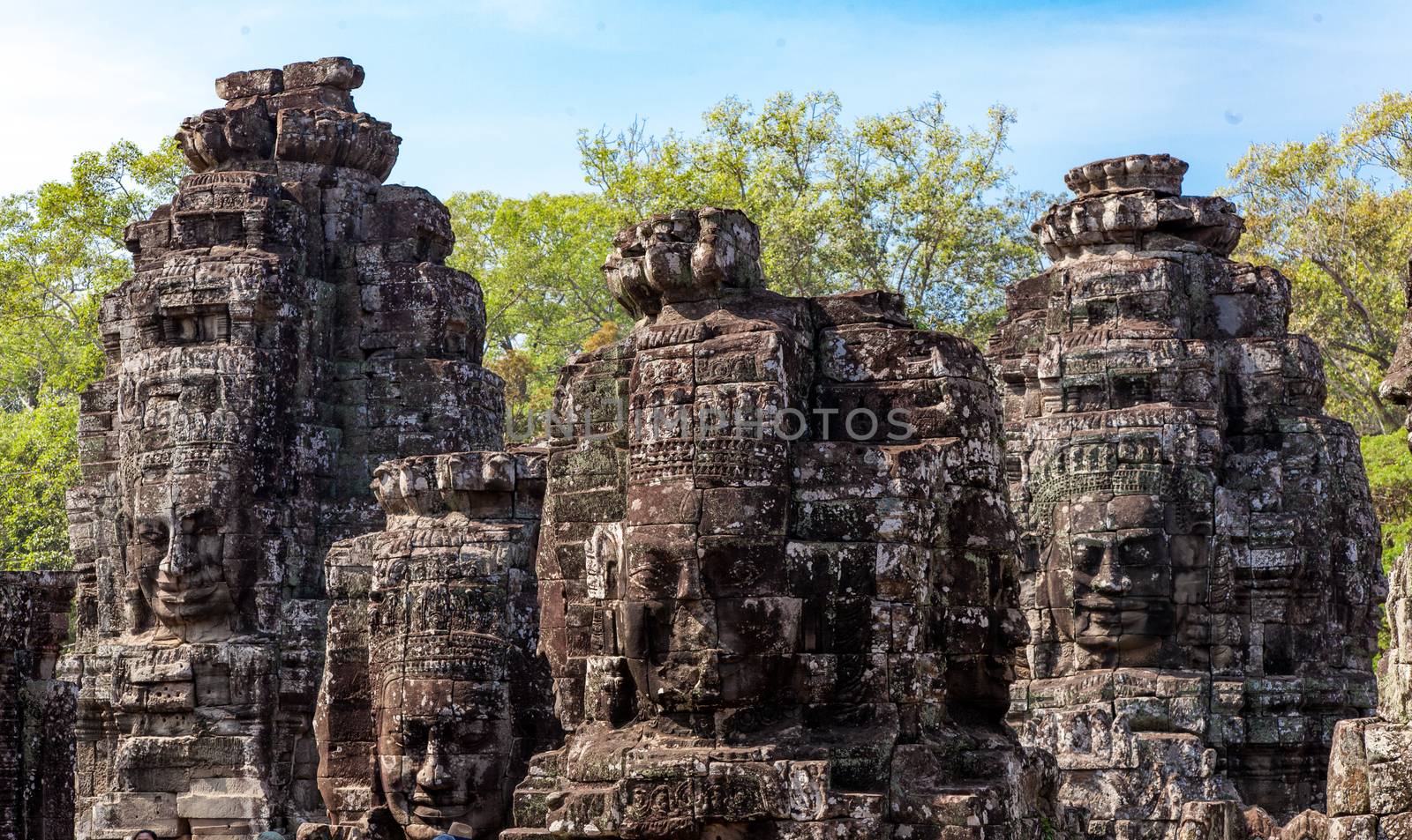The Bayon is a temple at Angkor in Cambodia with the huge faces of Jayavarman  by kgboxford