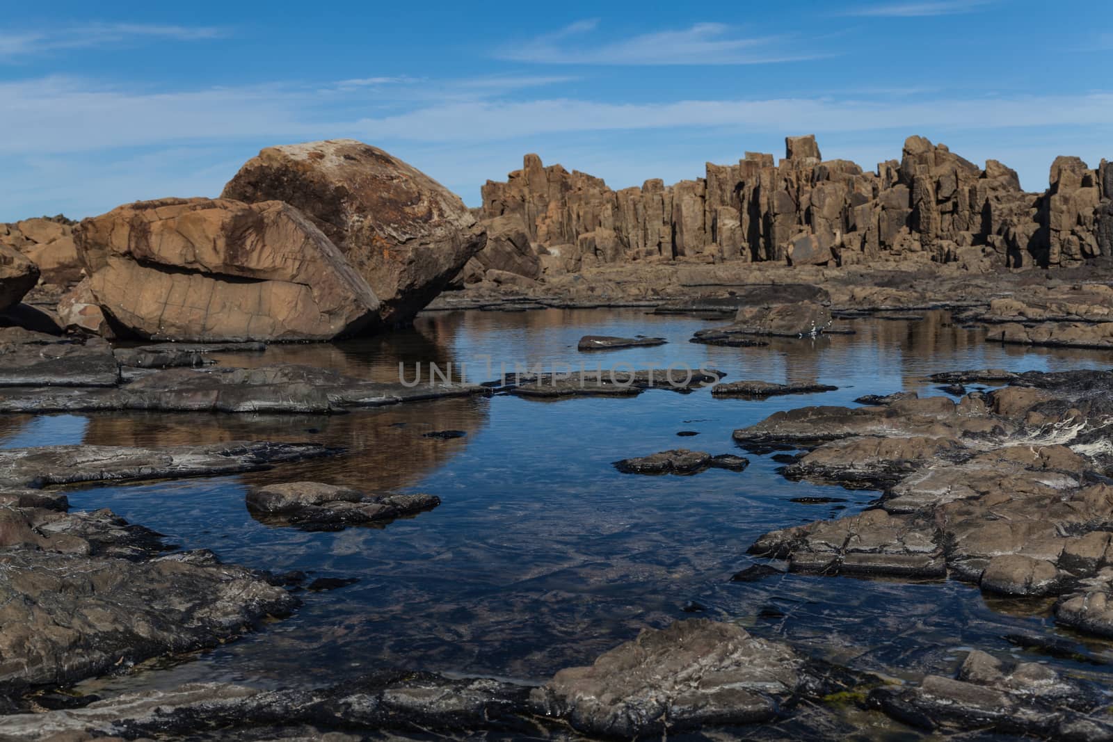 Bombo Headland Quarry Australia. Blue skies and reflections in water by kgboxford