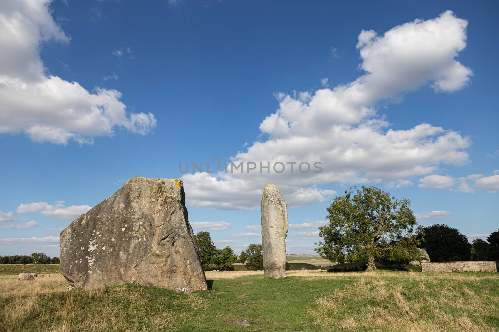 The Cove stones set against beautiful English countryside and blue skies with clouds.