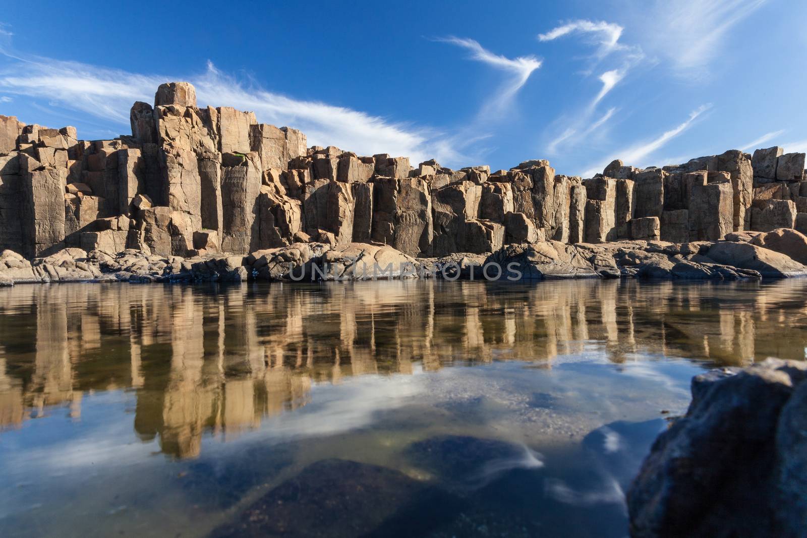 Bombo Headland Quarry Australia. Blue skies and reflections in water by kgboxford