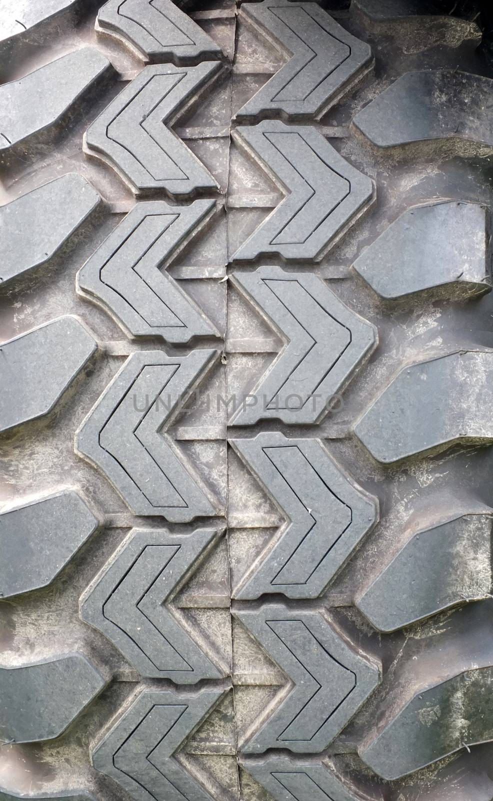 a close up of the tread of a heavy duty all terrain vehicle tyre
