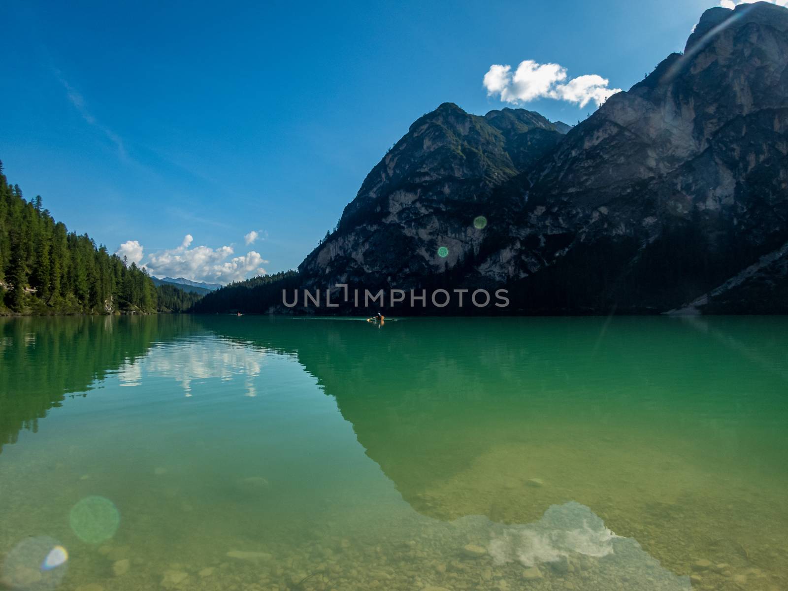 Hiking along the beautiful Braies lake in the Dolomites, South Tyrol