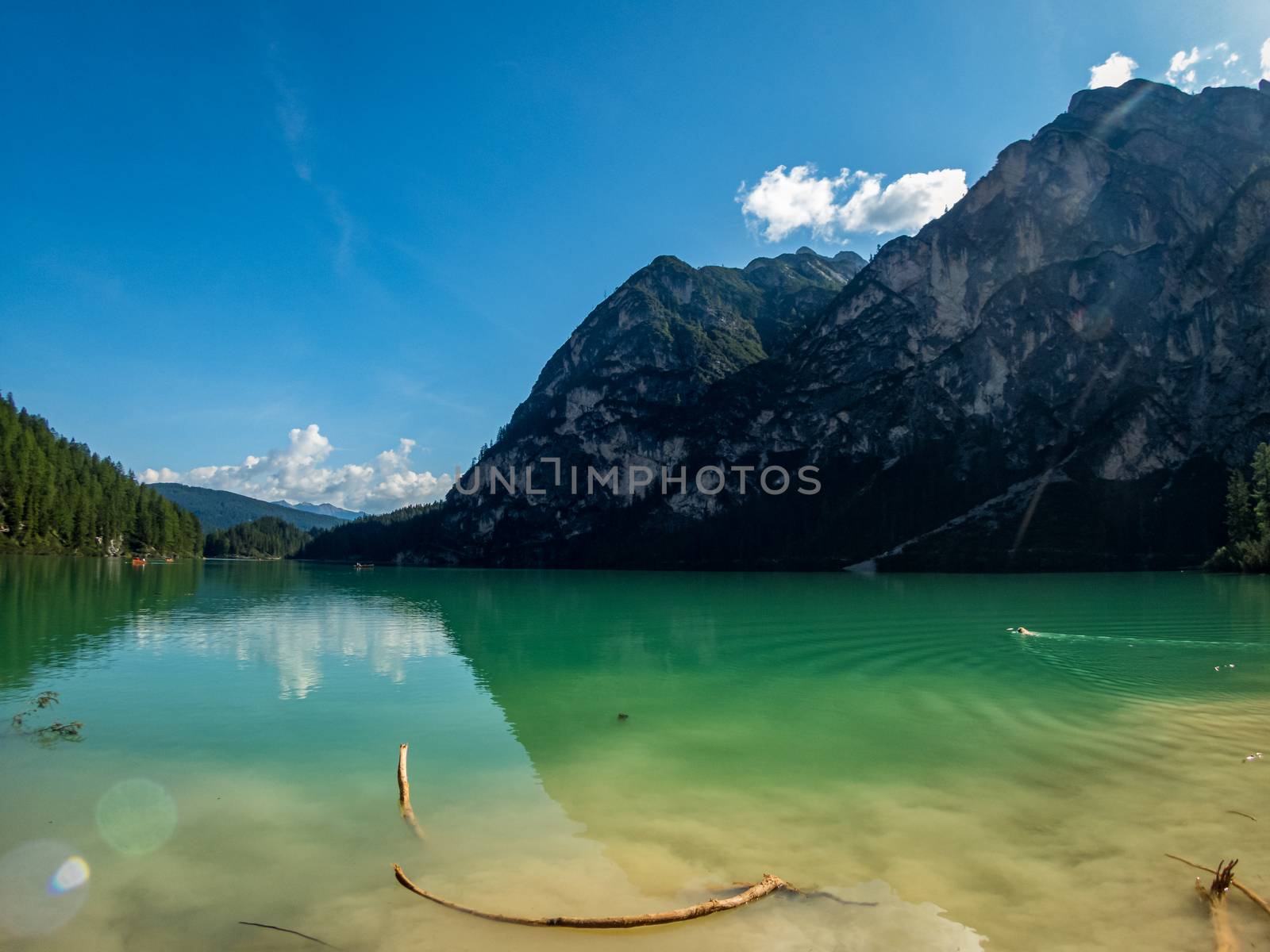 Hiking along the beautiful Braies lake in the Dolomites, South Tyrol