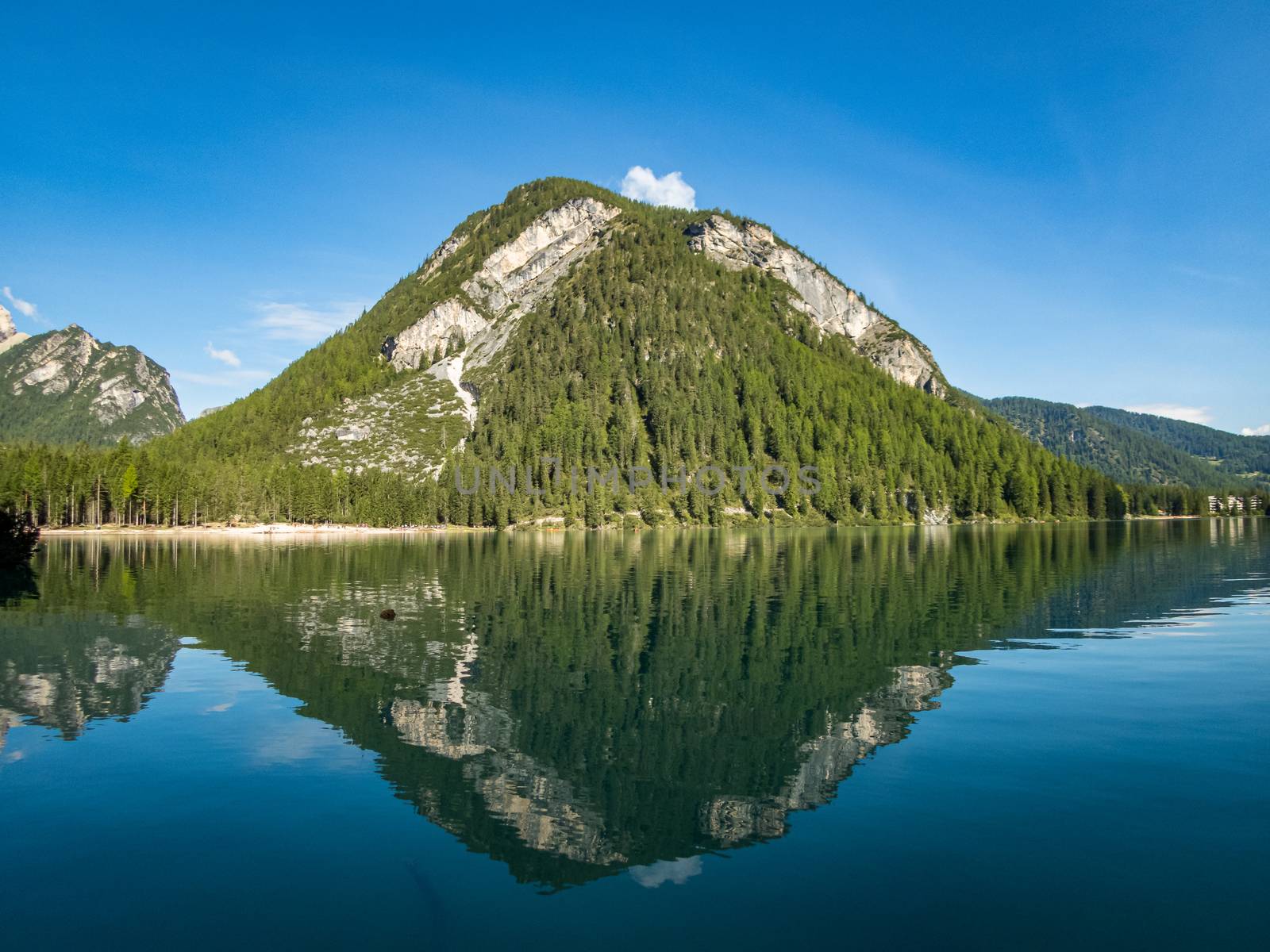 Hiking along the beautiful Braies lake in the Dolomites, South Tyrol