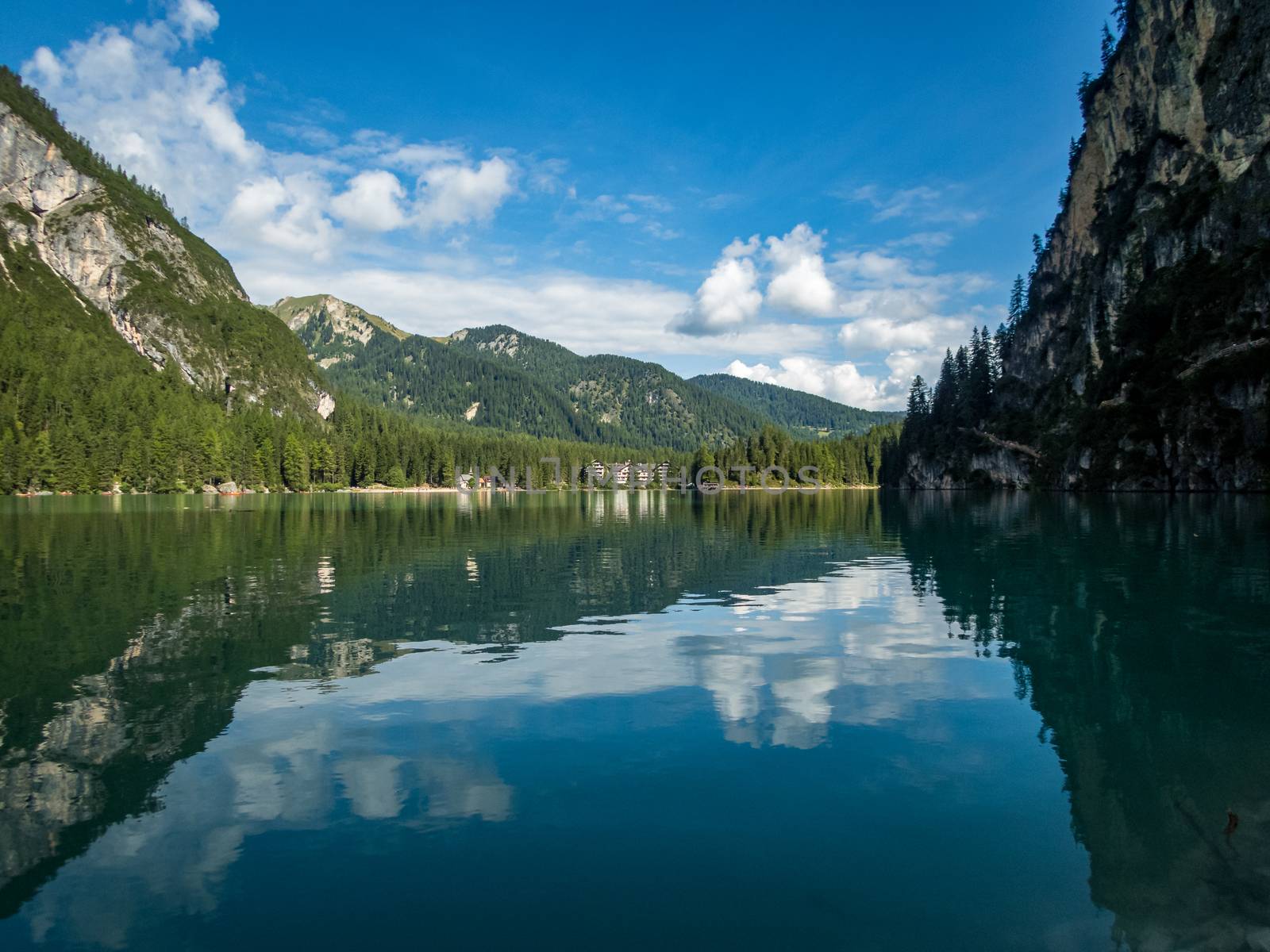 Hiking along the beautiful Braies lake in the Dolomites, South Tyrol