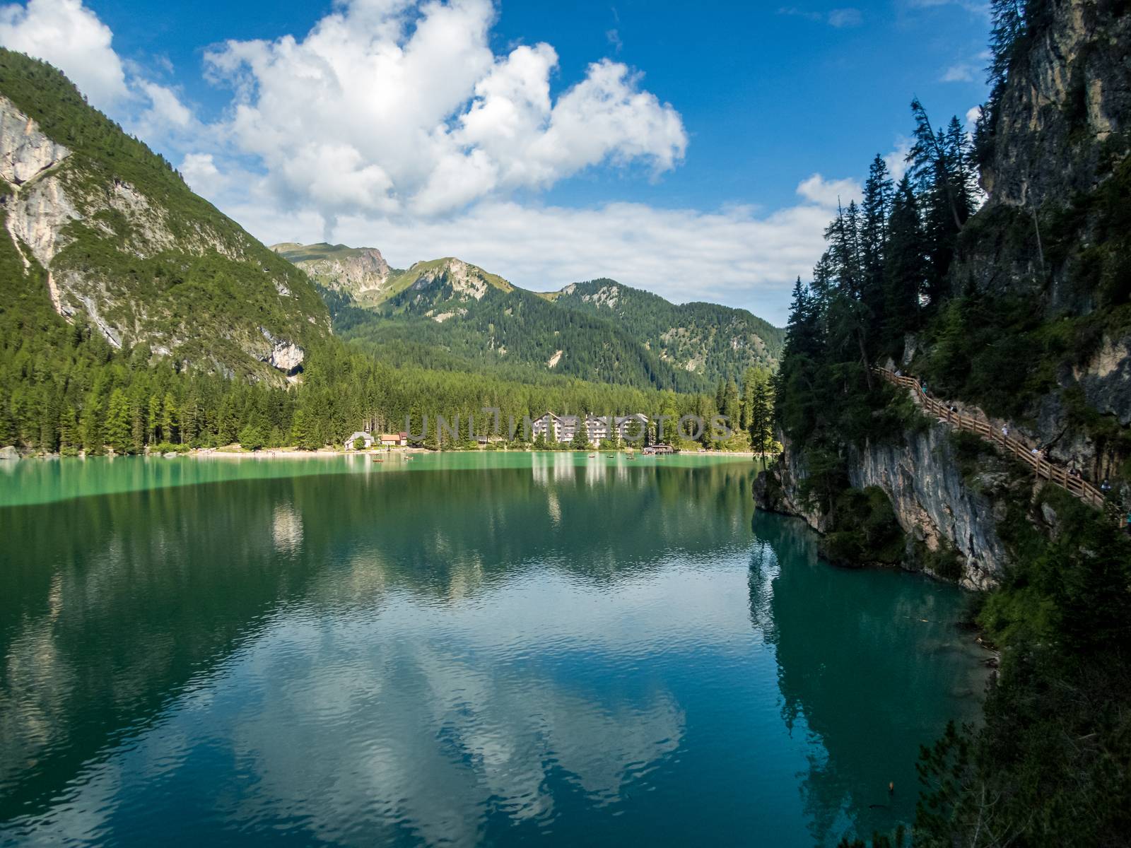 Hiking along the beautiful Braies lake in the Dolomites, South Tyrol