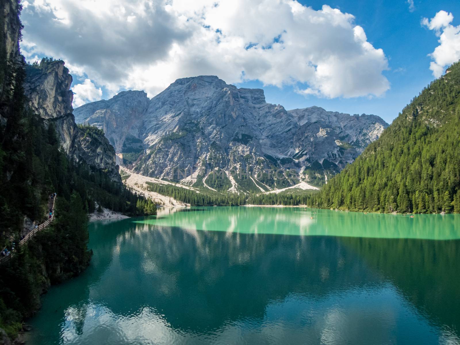 Hiking along the beautiful Braies lake in the Dolomites, South Tyrol