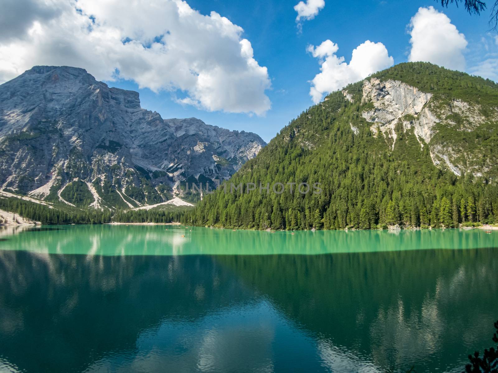 Hiking along the beautiful Braies lake in the Dolomites, South Tyrol