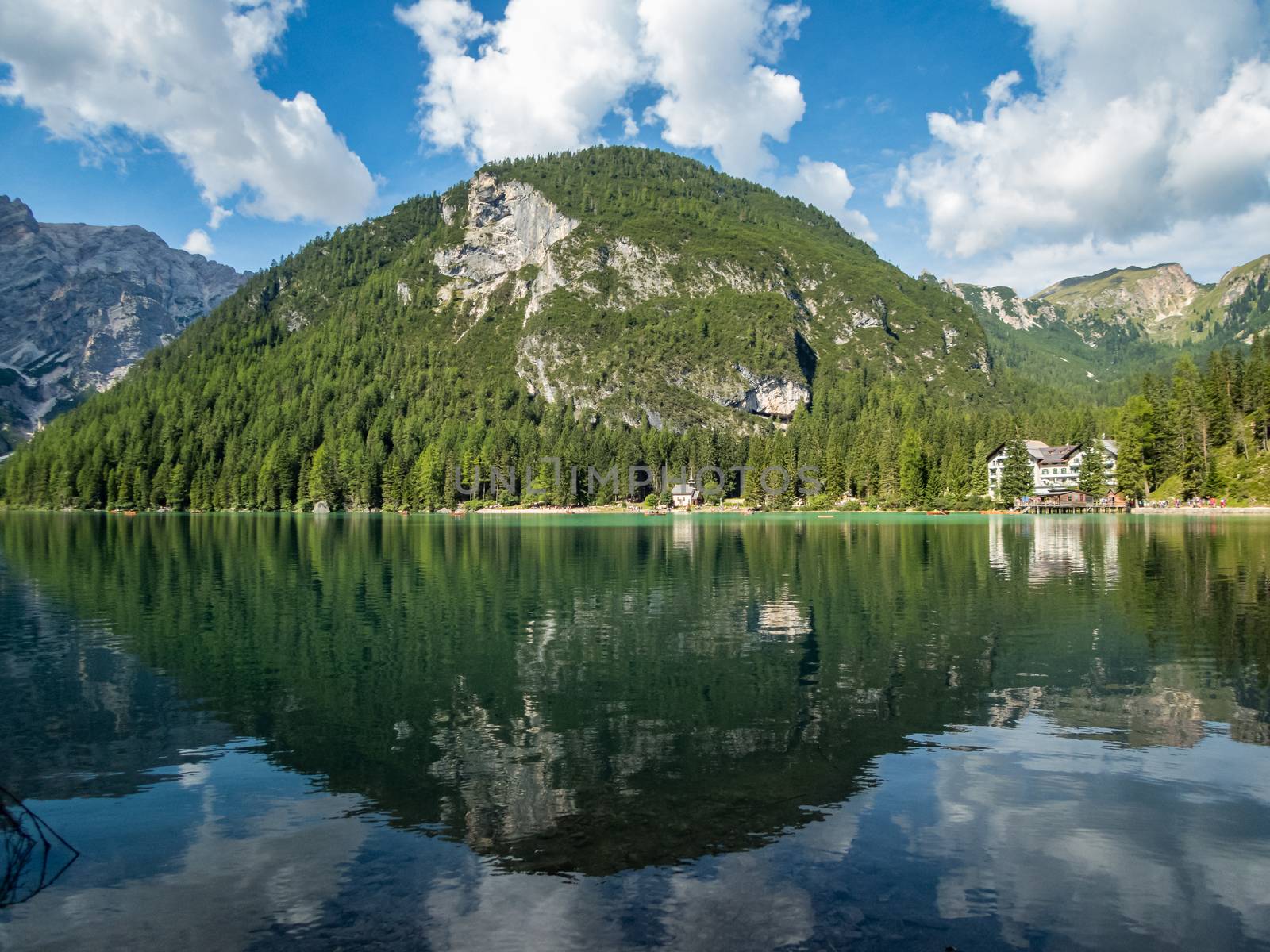 Hiking along the beautiful Braies lake in the Dolomites, South Tyrol