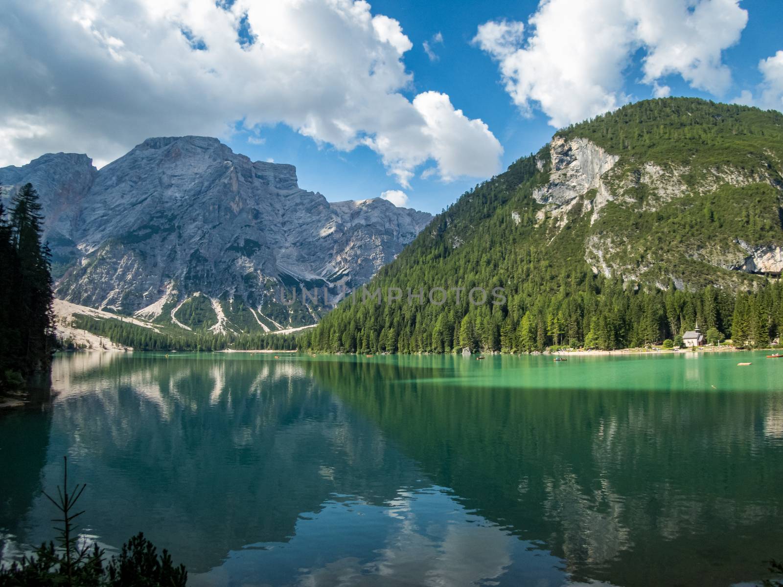 Hiking along the beautiful Braies lake in the Dolomites, South Tyrol