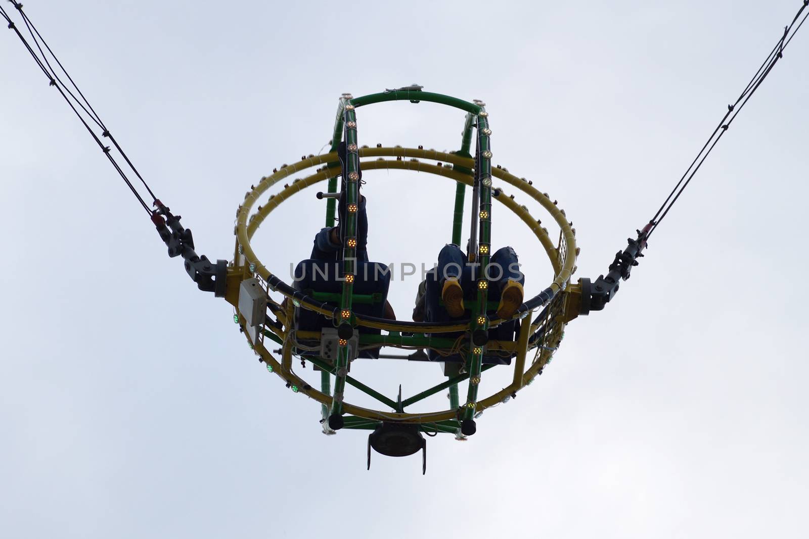 two people on the bungee ride bottom view. by Annado