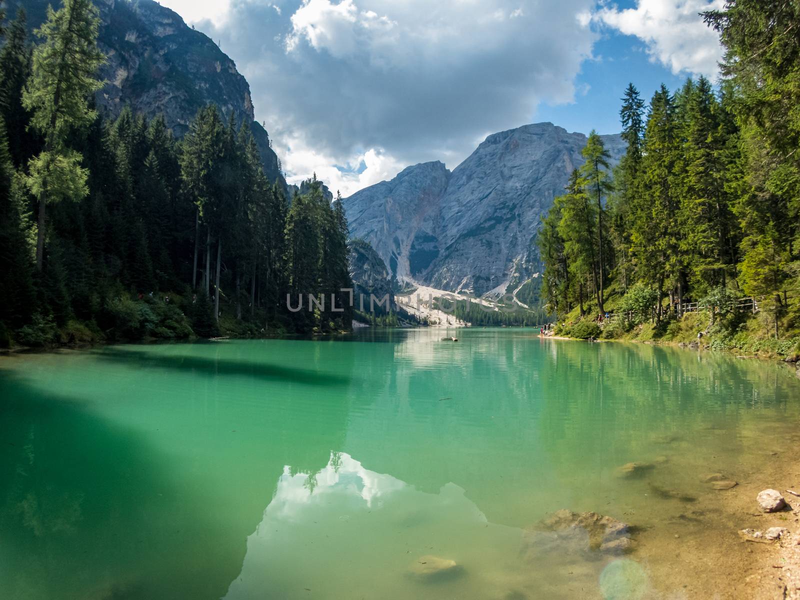 Hiking along the beautiful Braies lake in the Dolomites, South Tyrol