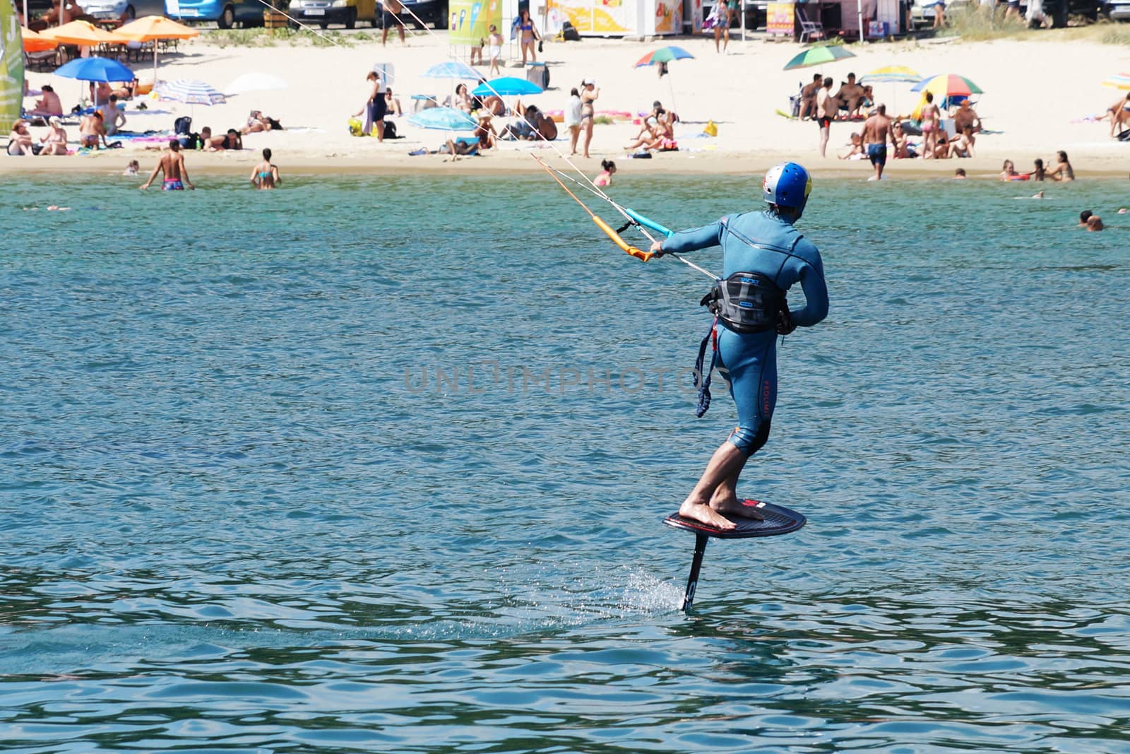 a man is kiting the sea against the background of the beachVarna by Annado