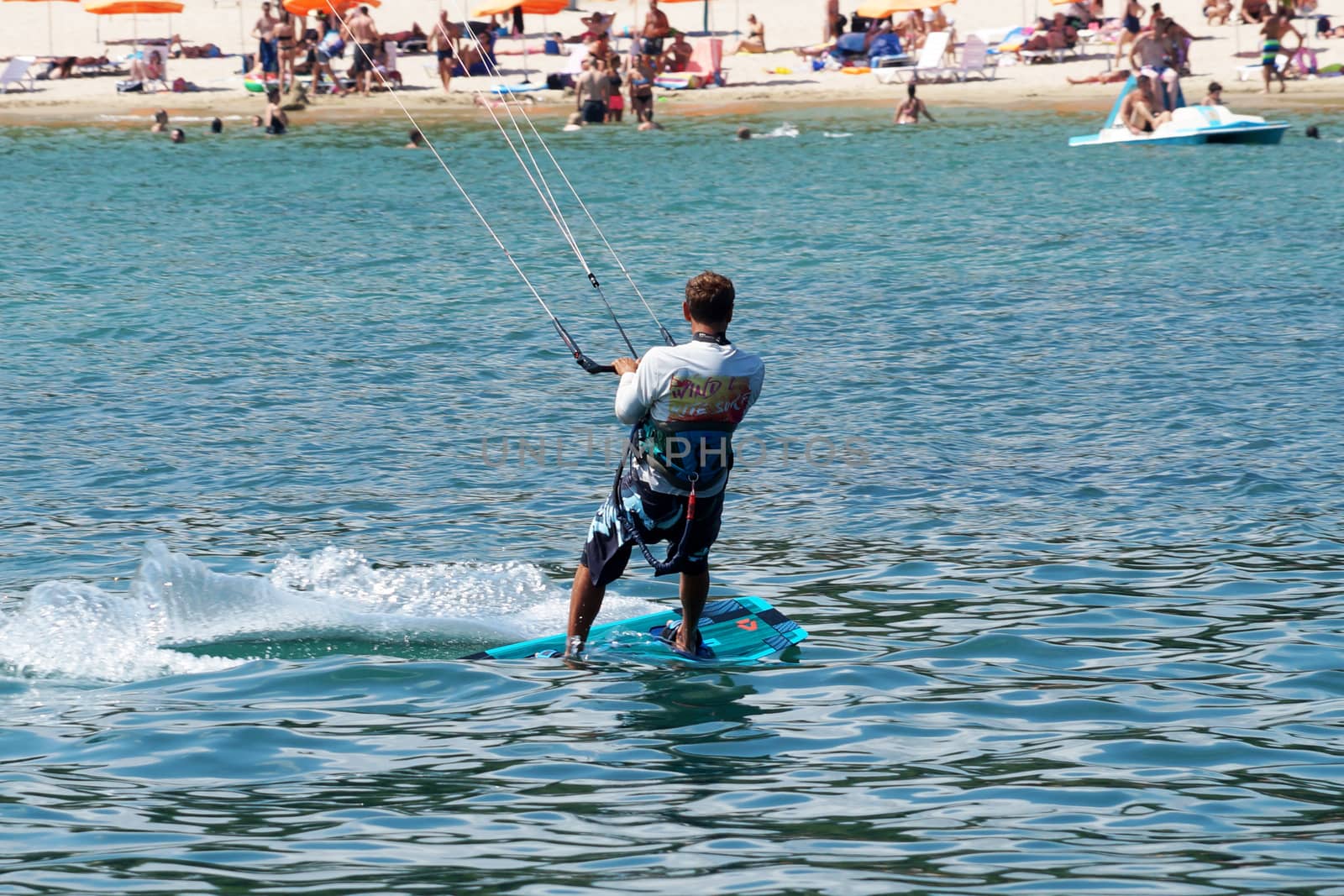 Varna, Bulgaria - July, 19, 2020: a man is kiting the sea against the background of the beachVarna