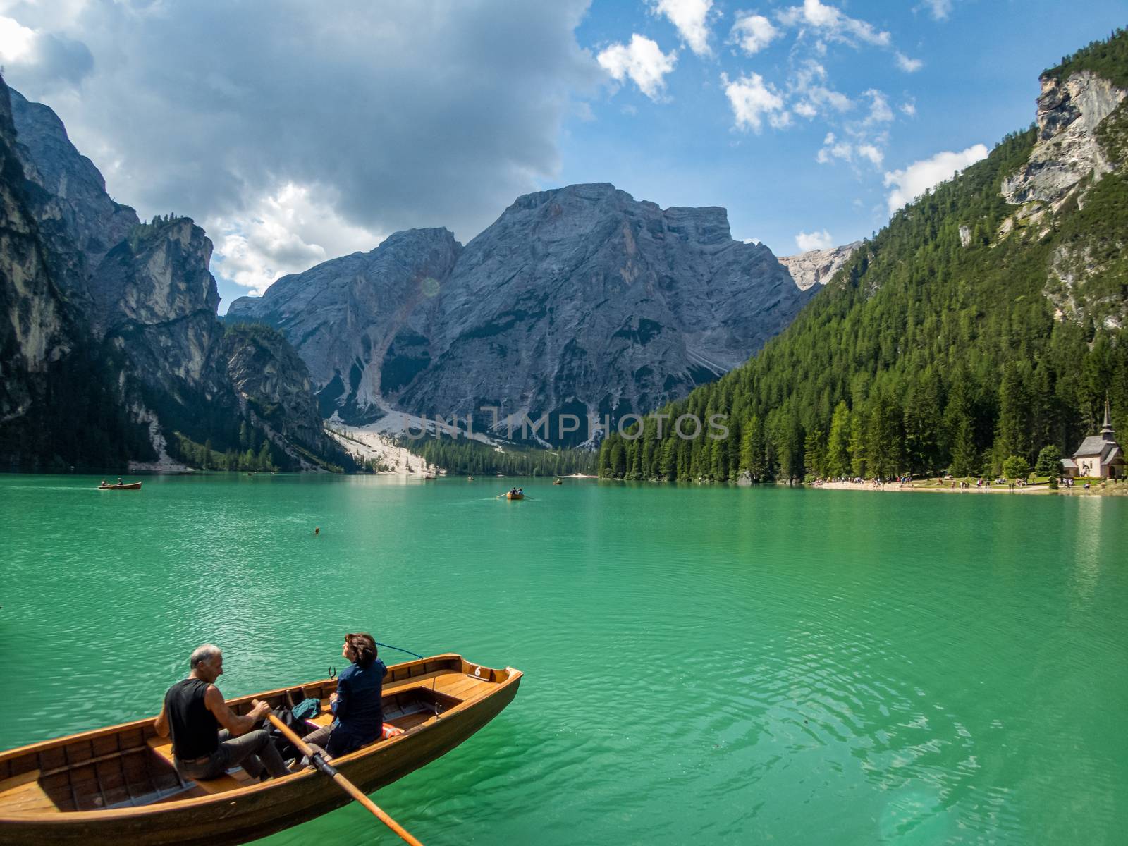 Hiking along the beautiful Braies lake in the Dolomites, South Tyrol