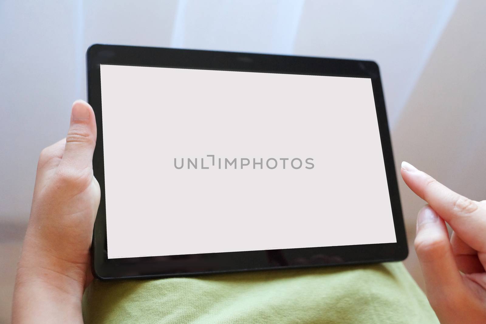 tablet with white screen in female hands, mock up by Annado