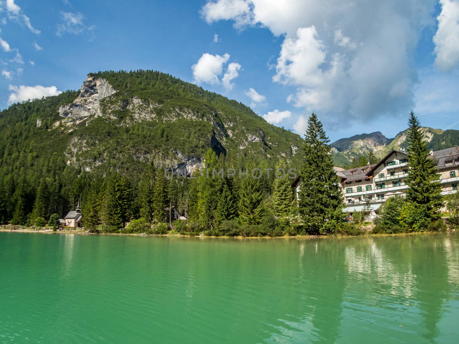 Hiking along the beautiful Braies lake in the Dolomites, South Tyrol