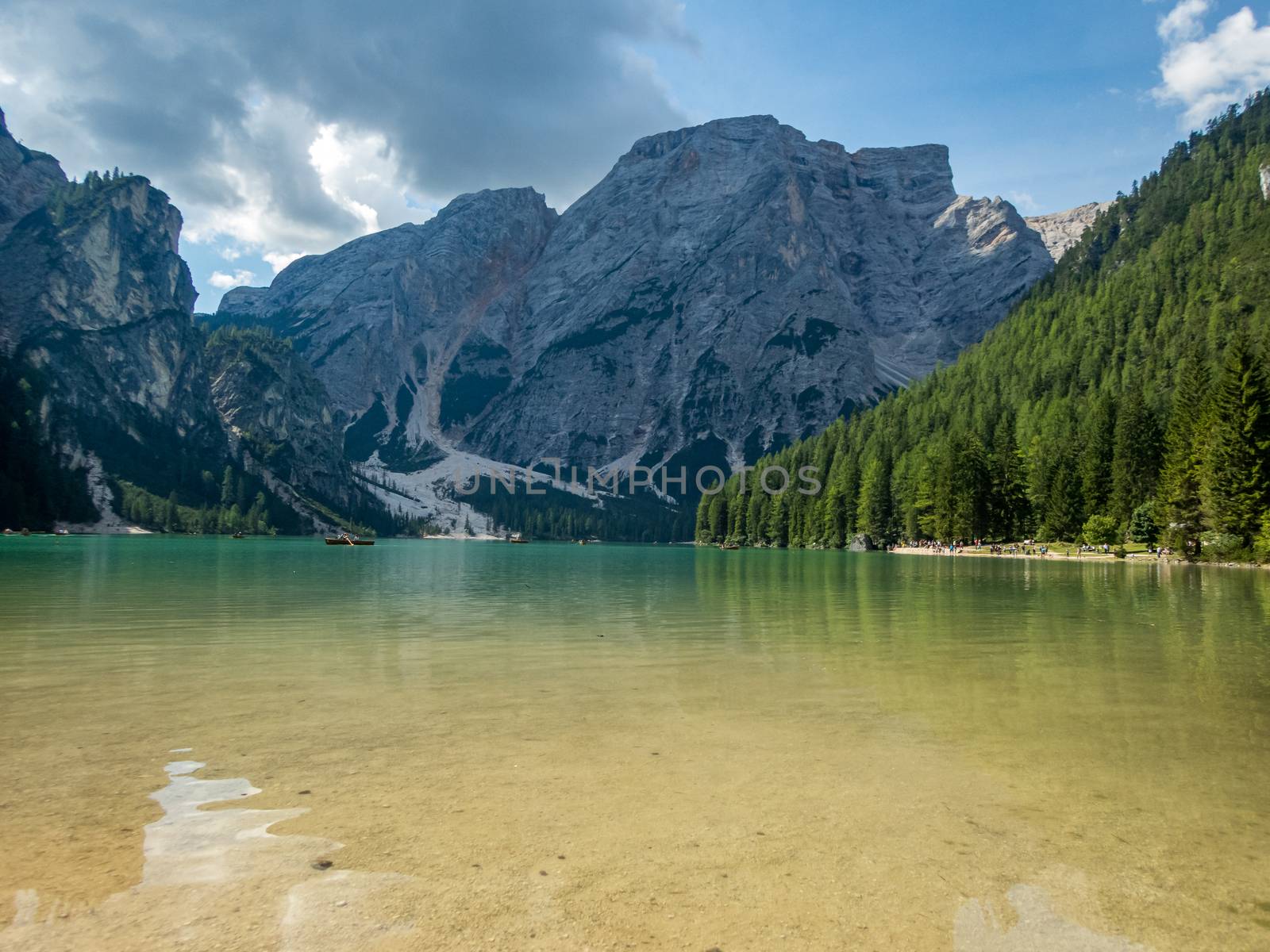 Hiking along the beautiful Braies lake in the Dolomites, South Tyrol