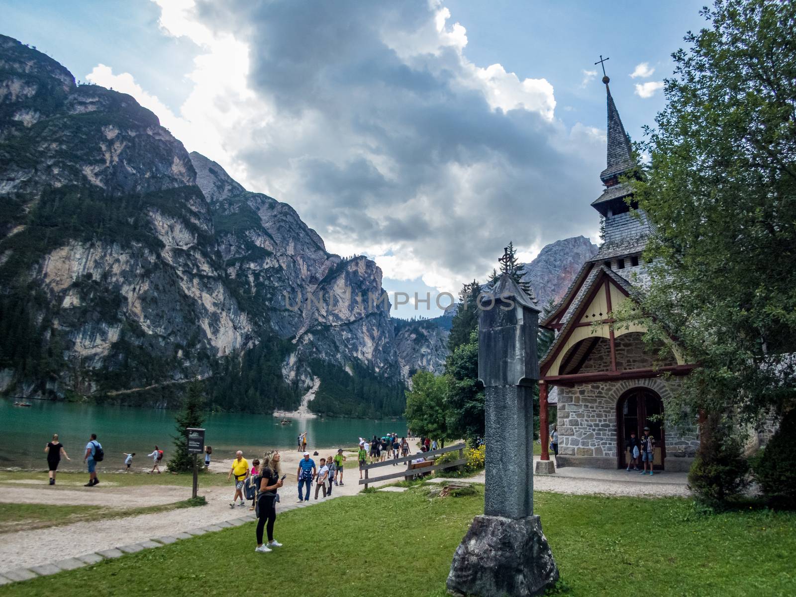 Hiking along the beautiful Braies lake in the Dolomites, South Tyrol