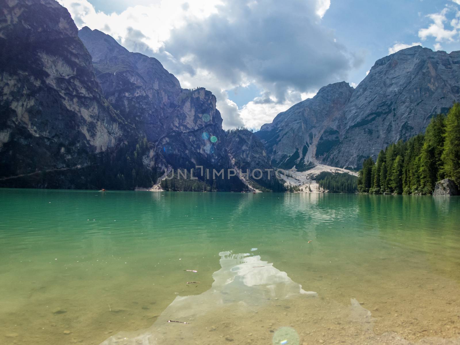 Hiking along the beautiful Braies lake in the Dolomites, South Tyrol