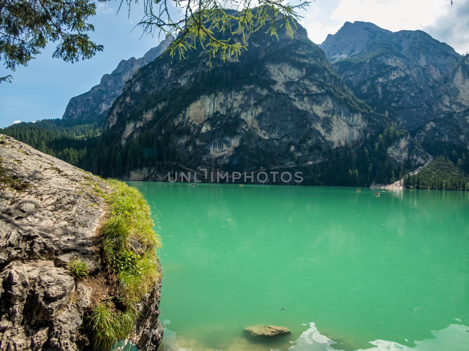 Hiking along the beautiful Braies lake in the Dolomites, South Tyrol