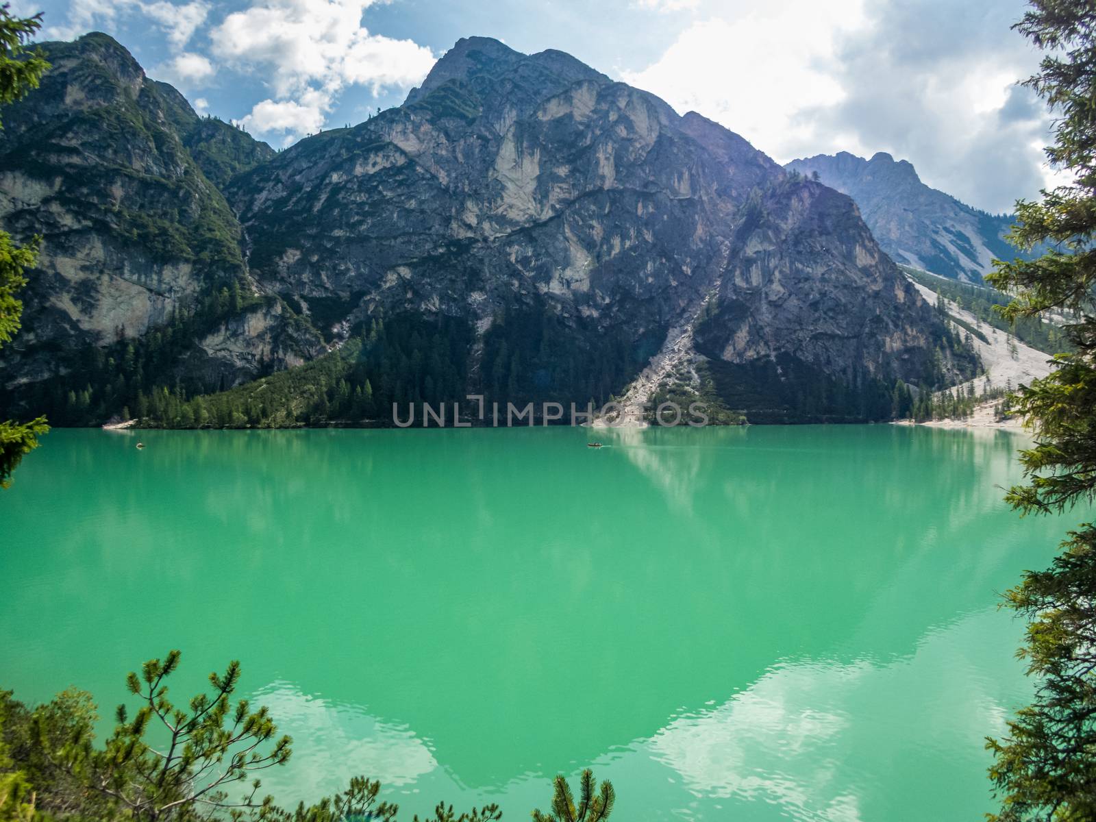 Hiking along the beautiful Braies lake in the Dolomites, South Tyrol