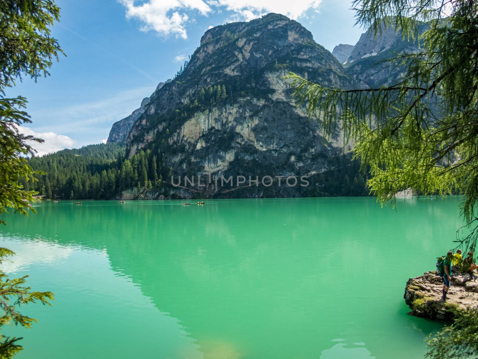 Hiking along the beautiful Braies lake in the Dolomites, South Tyrol