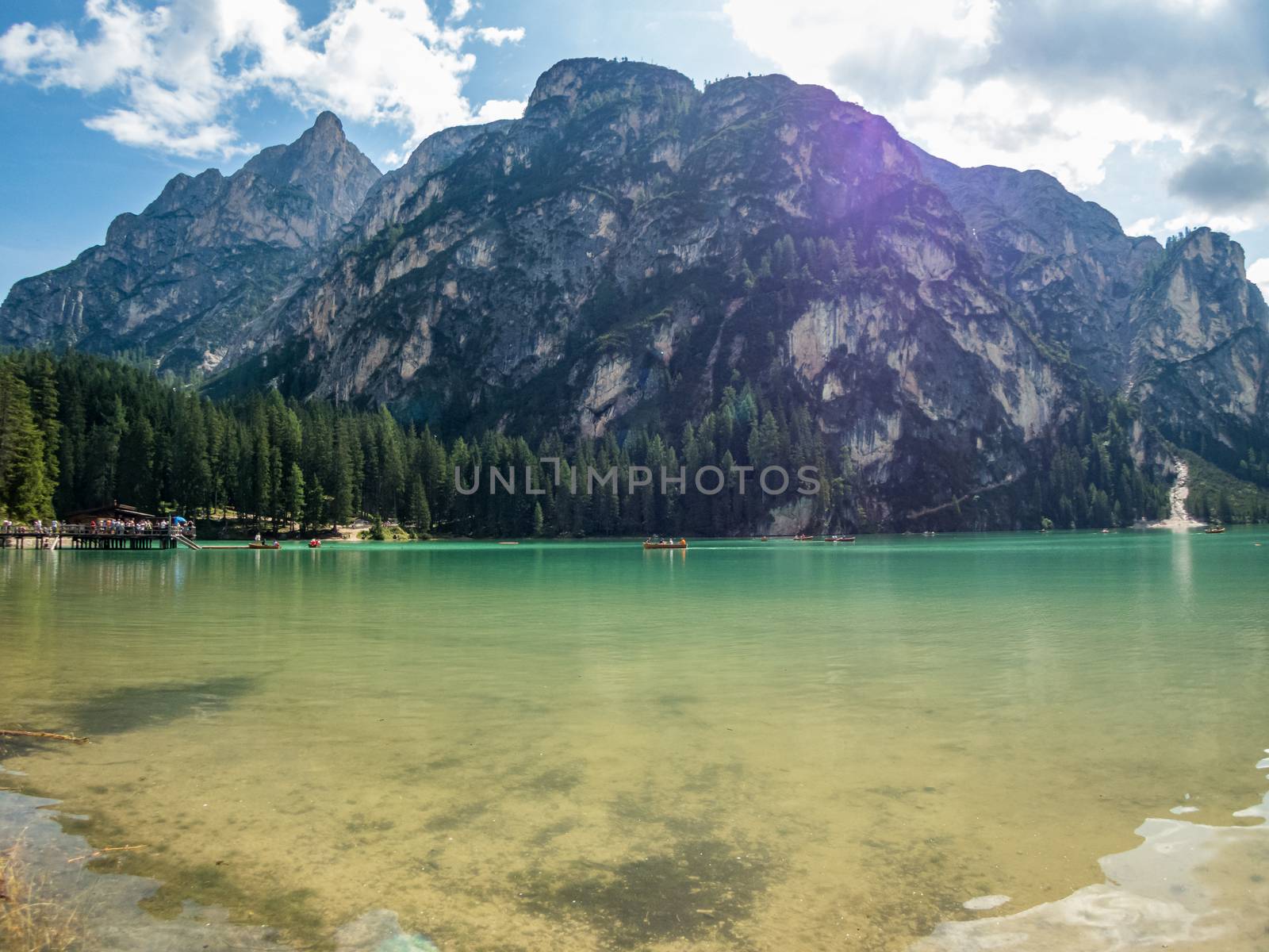 Hiking along the beautiful Braies lake in the Dolomites, South Tyrol