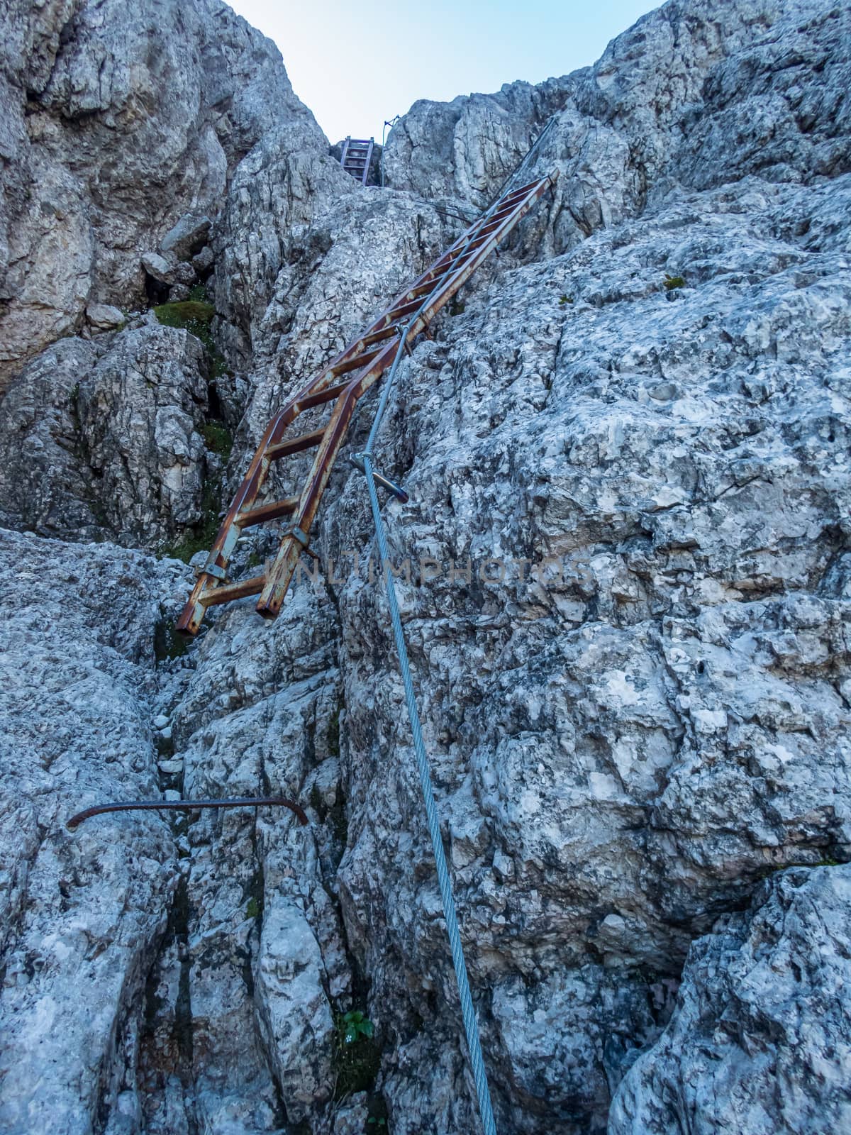 Climbing Rotwand via ferrata near Sexten in the Dolomites, South Tyrol, Italy