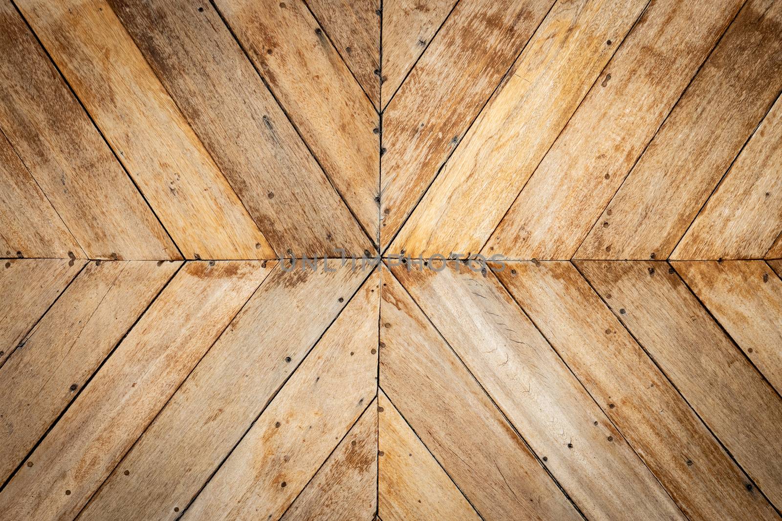 seamless brown color lumber in arrows or chevron pattern to the center. top view