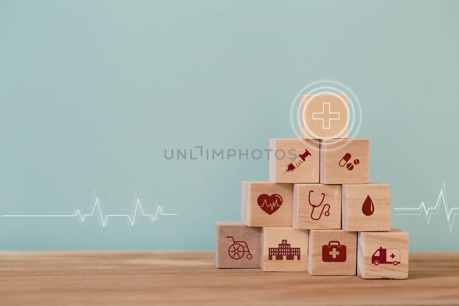 Healthcare concept about of health and medical insurance, arranging wood block stacking with icon healthcare medical on table wooden background. by setila