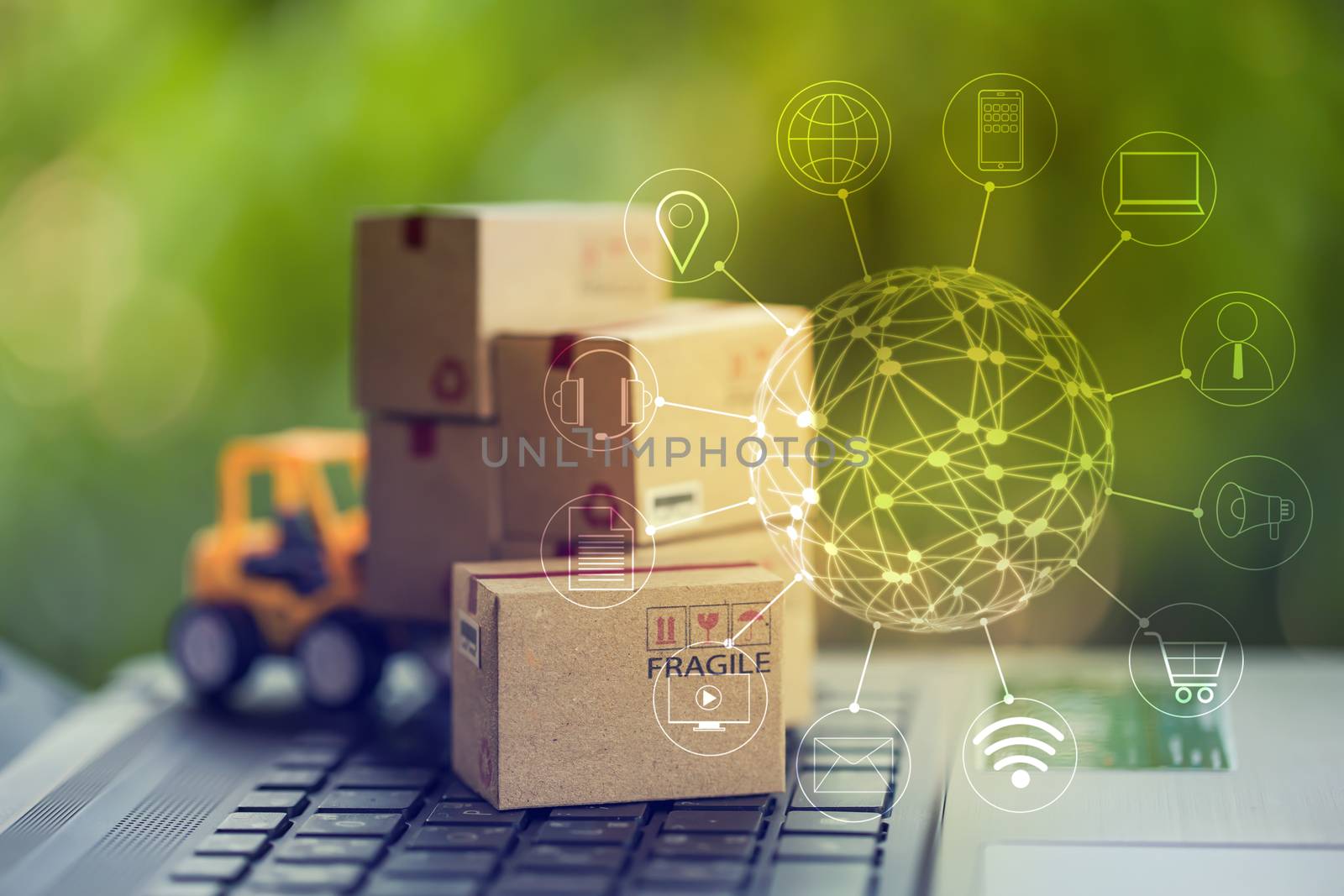 Logistic, supply / Online shopping concept:  Fork-lift truck moves cardboard box on keyboard with icon customer network connection. International freight or shipping service for online shopping.