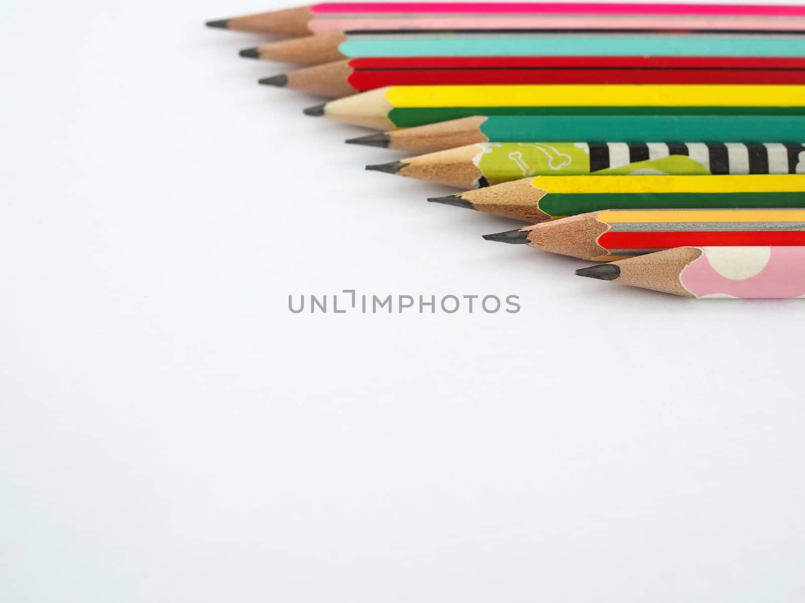 A pencil arranged in a row on a white background.