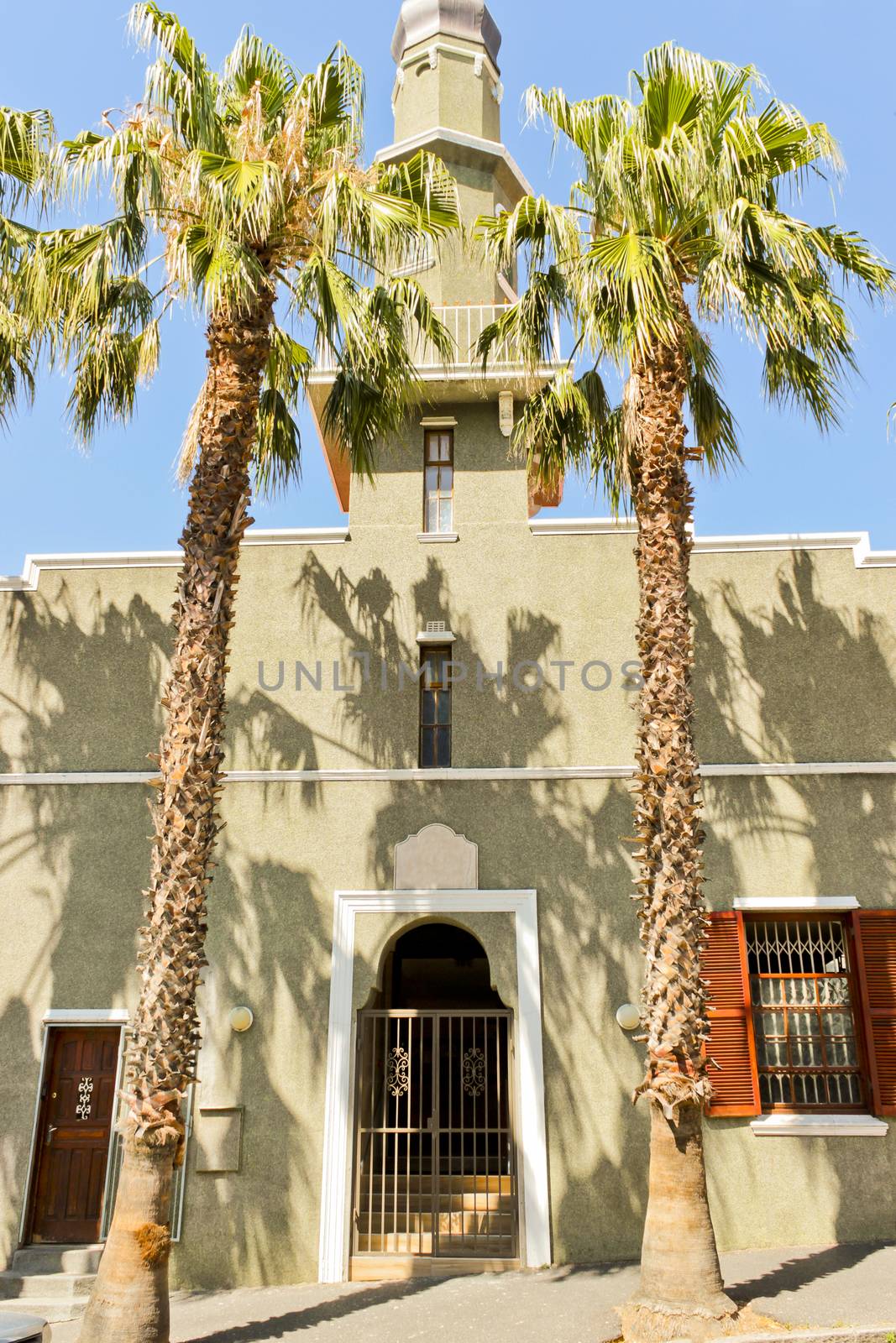 Noble entrance, noble gate of mosque with palms Cape Town. by Arkadij