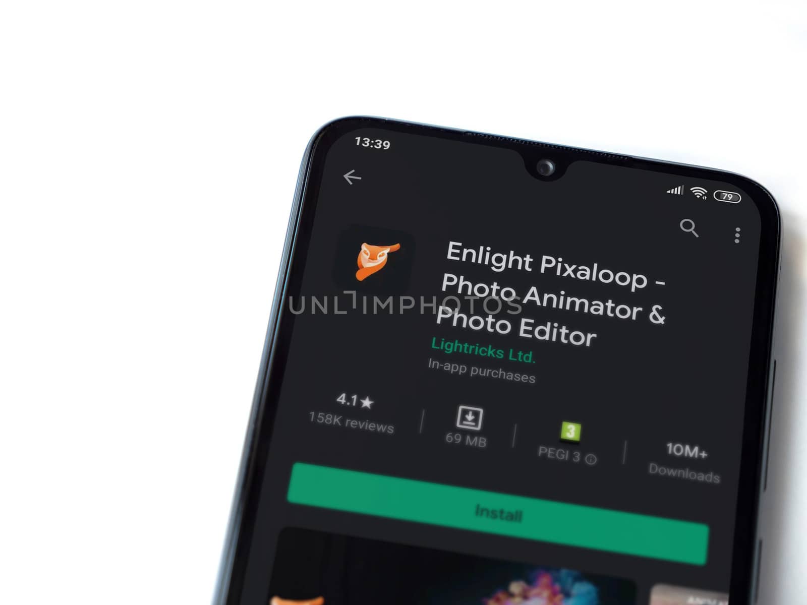 Lod, Israel - July 8, 2020: Enlight Pixaloop app play store page on the display of a black mobile smartphone isolated on white background. Top view flat lay with copy space.