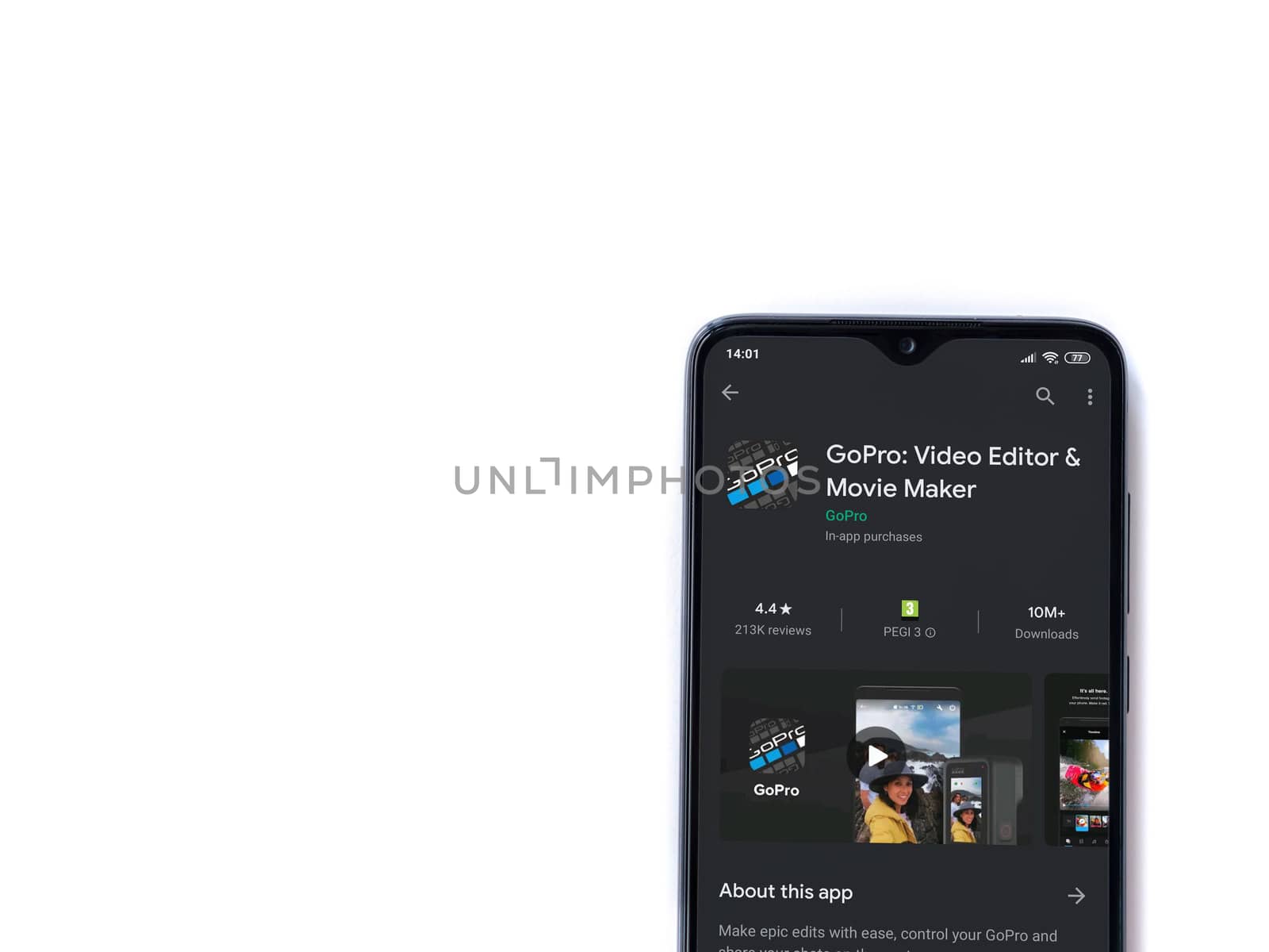 Lod, Israel - July 8, 2020: GoPro - Video Editor & Movie Maker app play store page on the display of a black mobile smartphone isolated on white background. Top view flat lay with copy space.