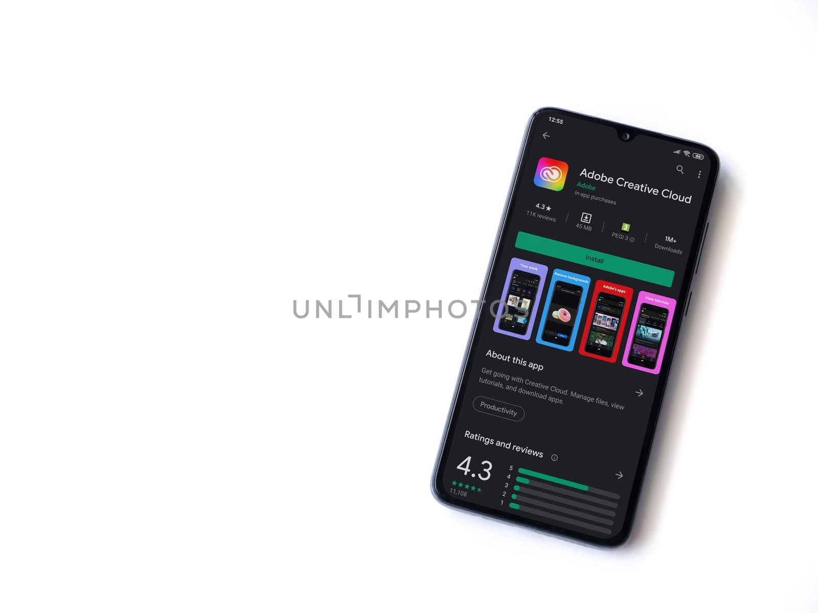 Lod, Israel - July 8, 2020: Adobe Creative Cloud app play store page on the display of a black mobile smartphone isolated on white background. Top view flat lay with copy space.