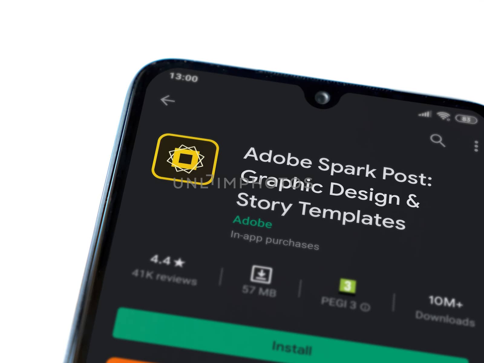 Lod, Israel - July 8, 2020: Adobe Spark Post - Graphic Design & Story Templates app play store page on the display of a black mobile smartphone on white background. Top view flat lay with copy space. 