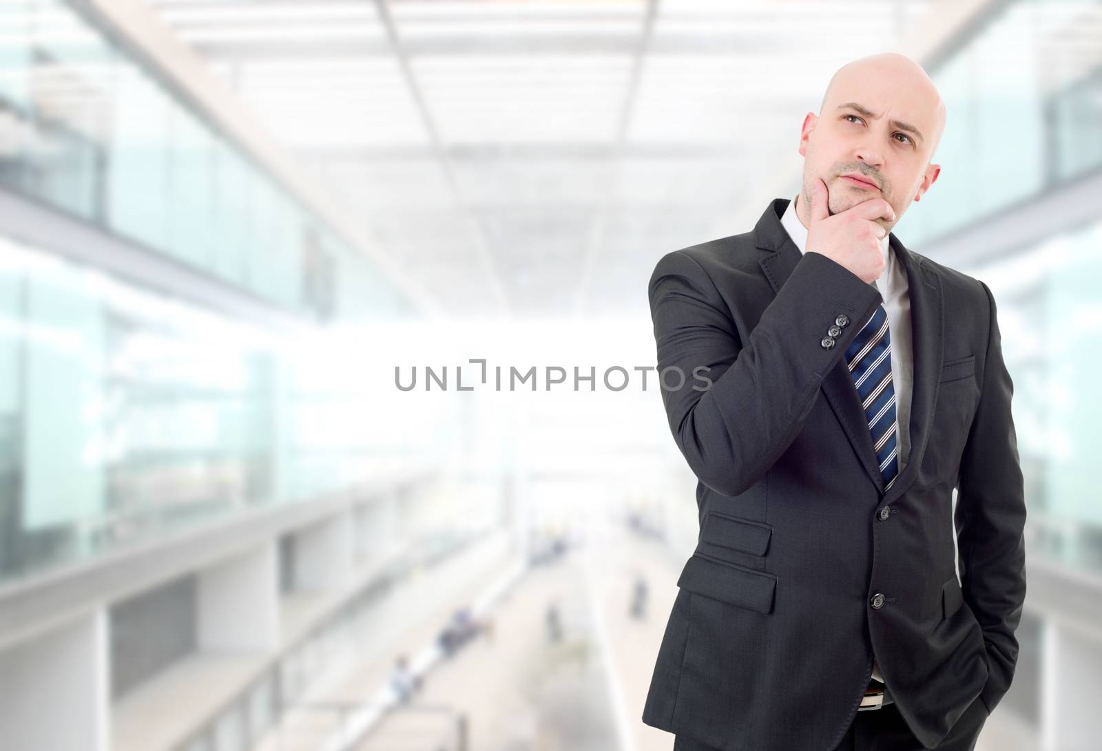 young business man thinking, at the office