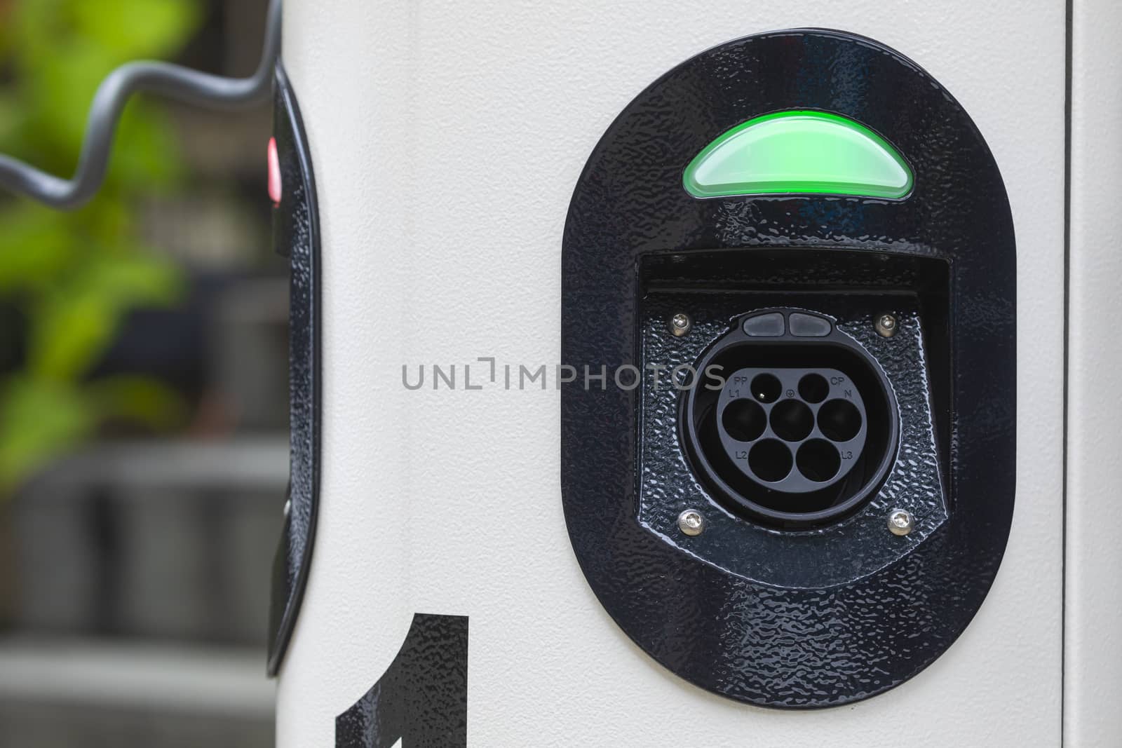 Electric car charging station at street level in Singapore, Southeast Asia.