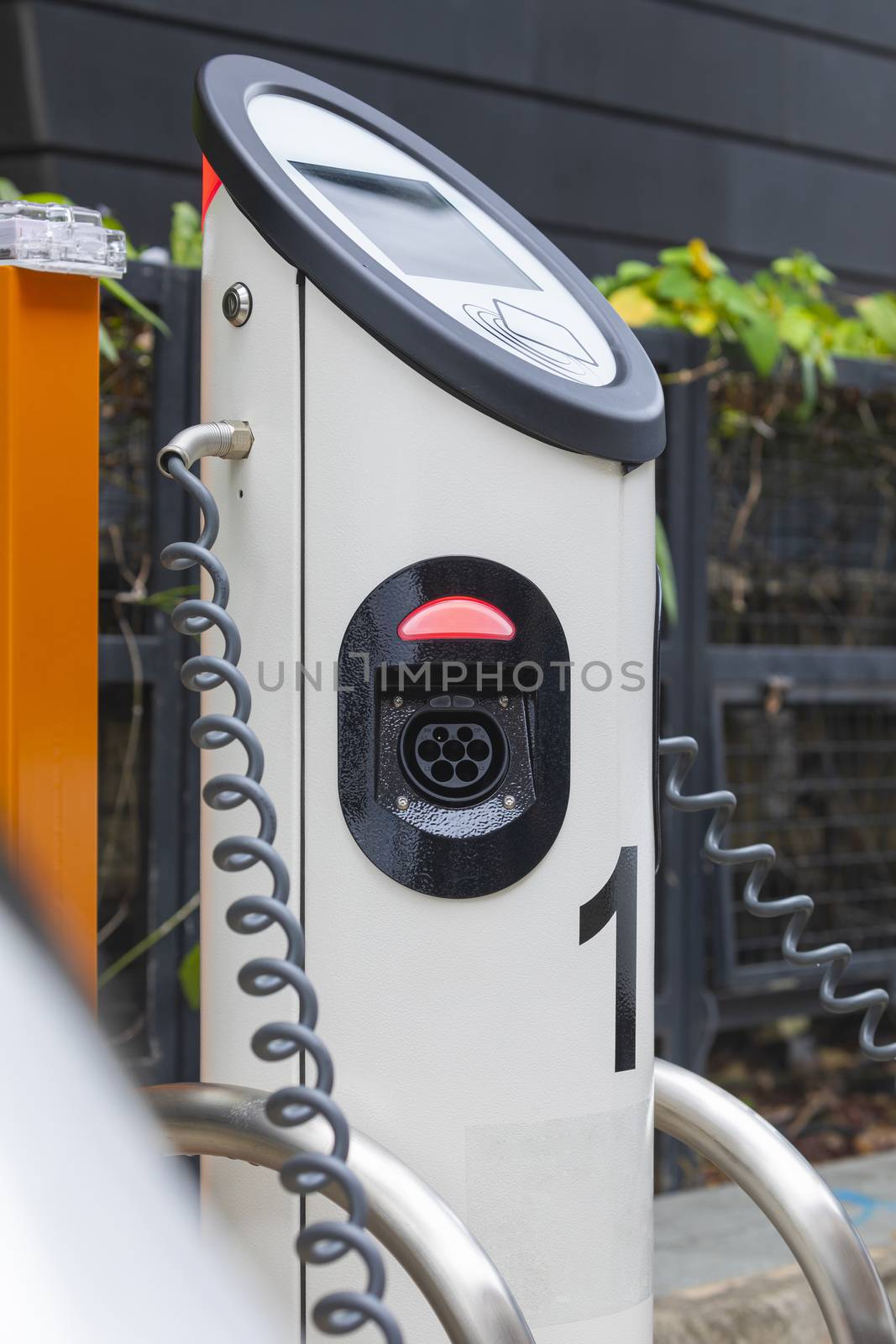 Electric car charging station at street level in Singapore, Southeast Asia.