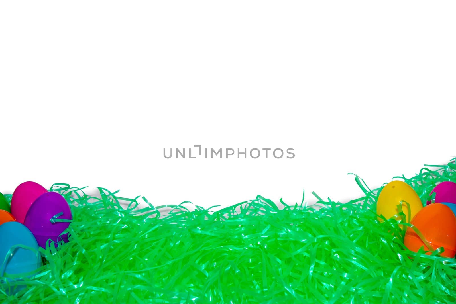 Easter Grass and Colorful Eggs With a Pure White Background Behi by bju12290