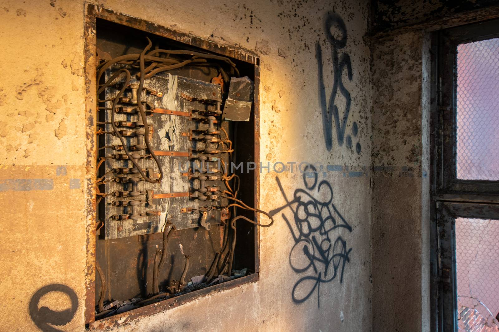 An Old and Rusty Electrical Panel in an Abandoned Building
