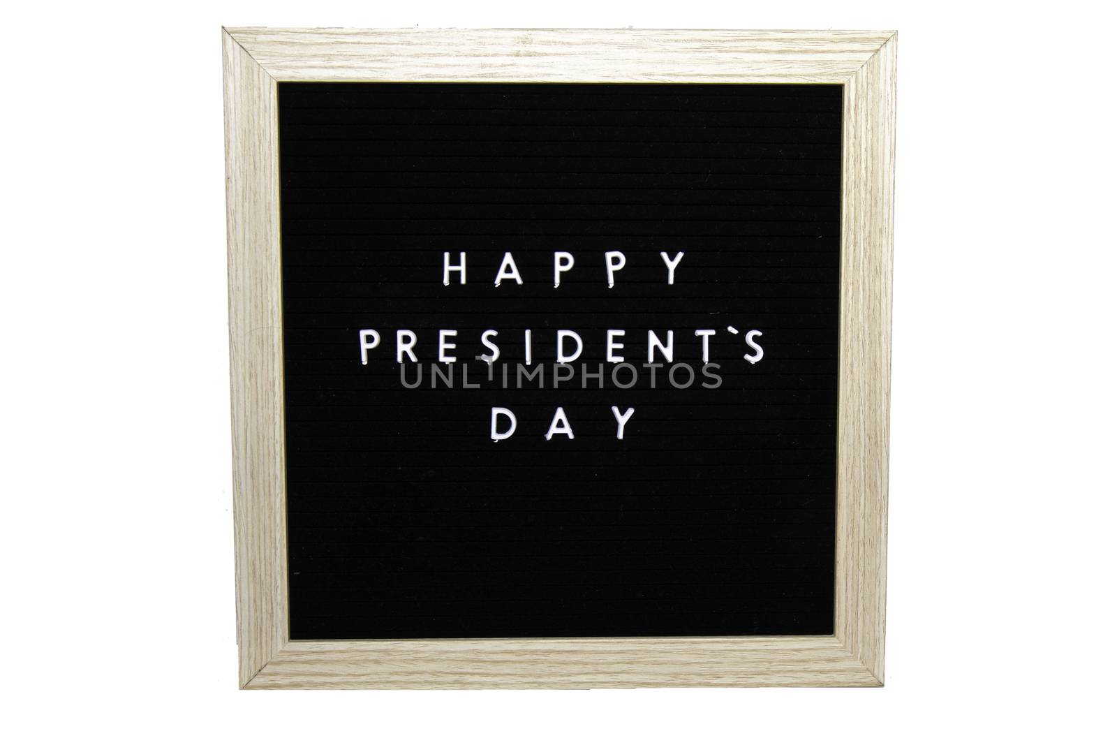 A Black Sign With a Birch Frame That Says Happy Presidents Day in White Letters on a Pure White Background