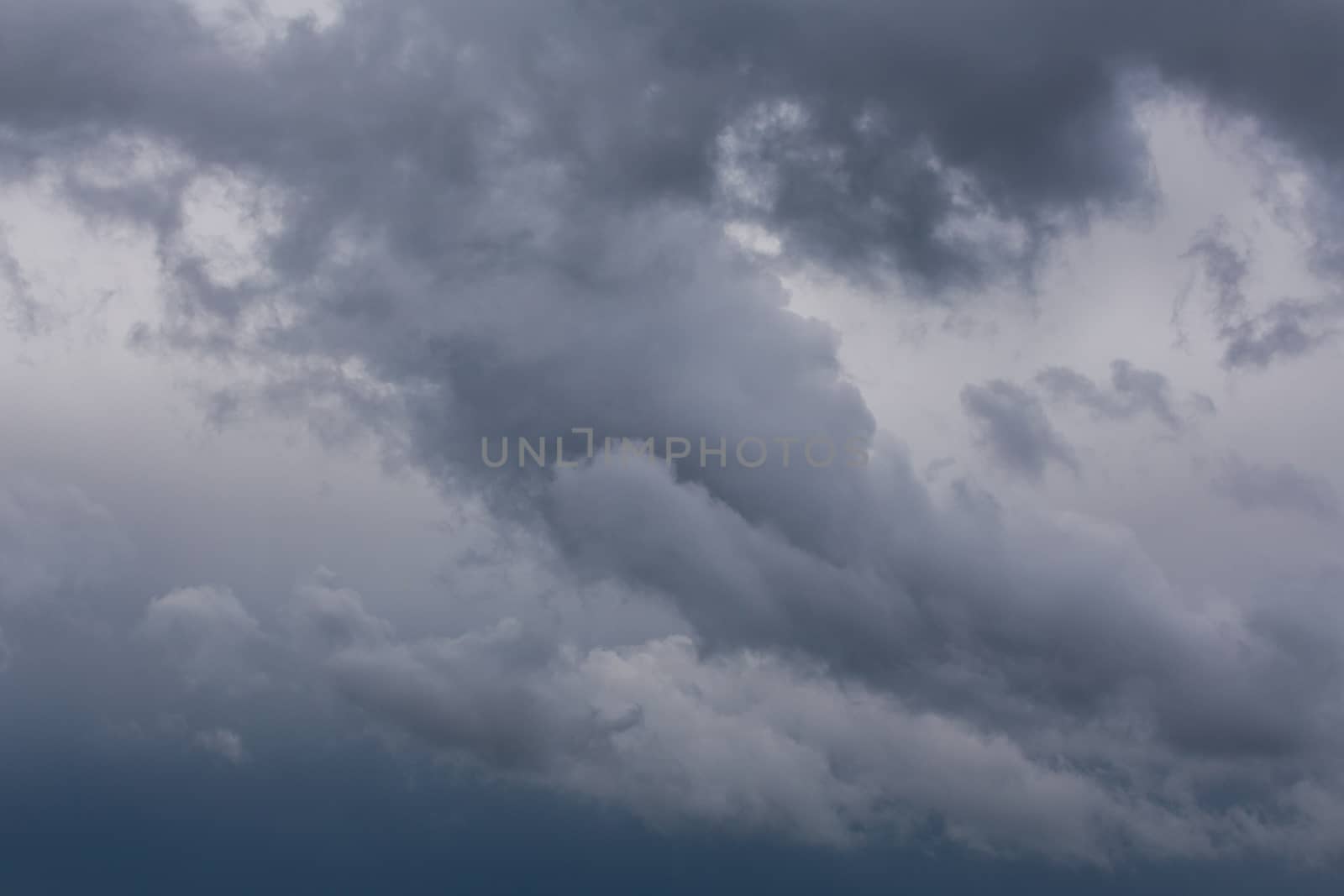 gray incoming storm clouds closeup backdrop, captured with telephoto lens