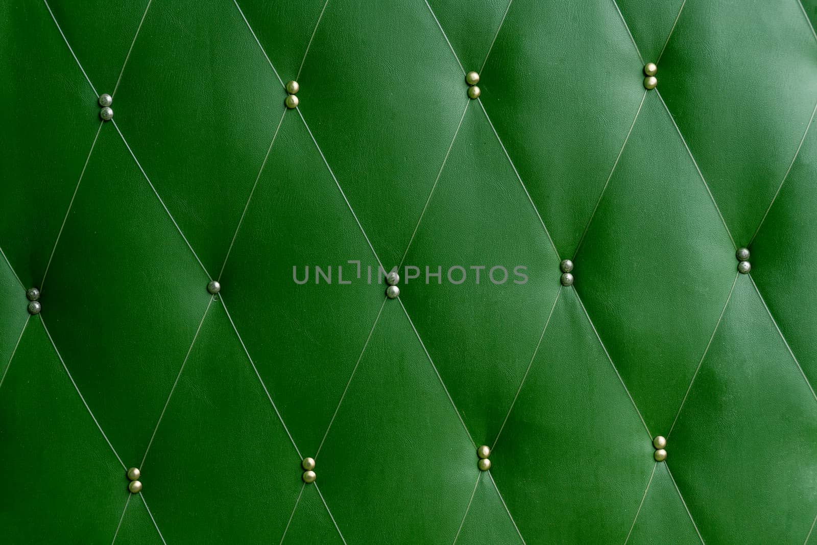 Soviet soft green dermantine front door with a banner of fishing line and nails - full frame background and texture.