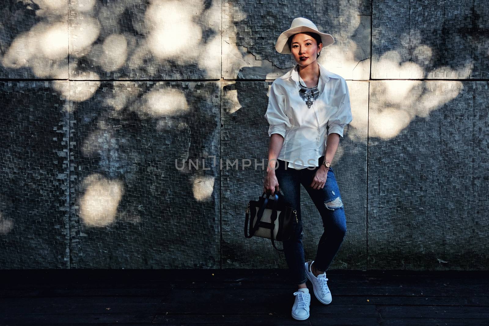 Fashion Portrait of a beautiful young woman model in white shirt by Surasak