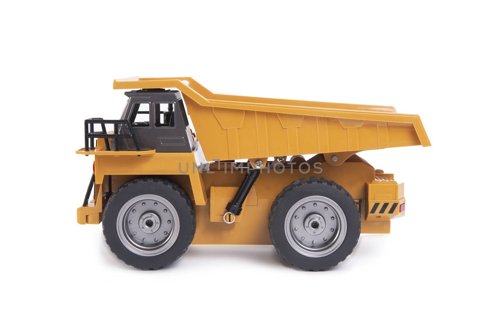 Yellow truck toy model on white background. by pandpstock_002