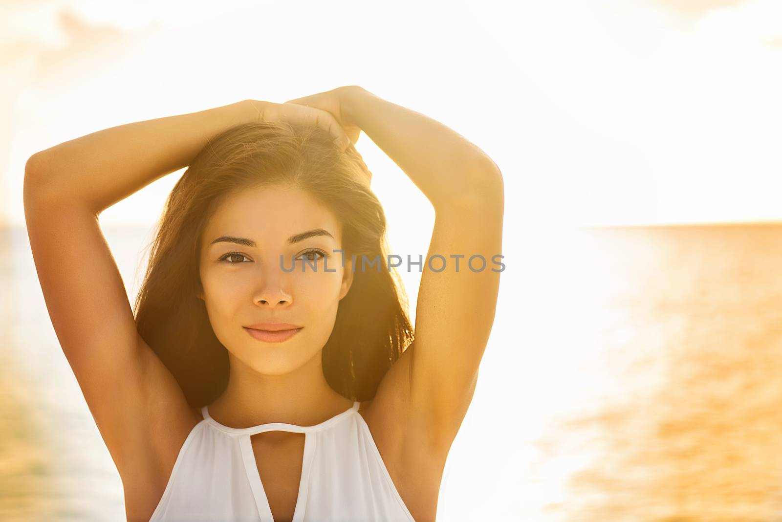 Asian beauty young woman multiracial girl portrait on beach at sunset. Face for natural makeup, healthy skin lifestyle. Beautiful Chinese model posing outside by Maridav