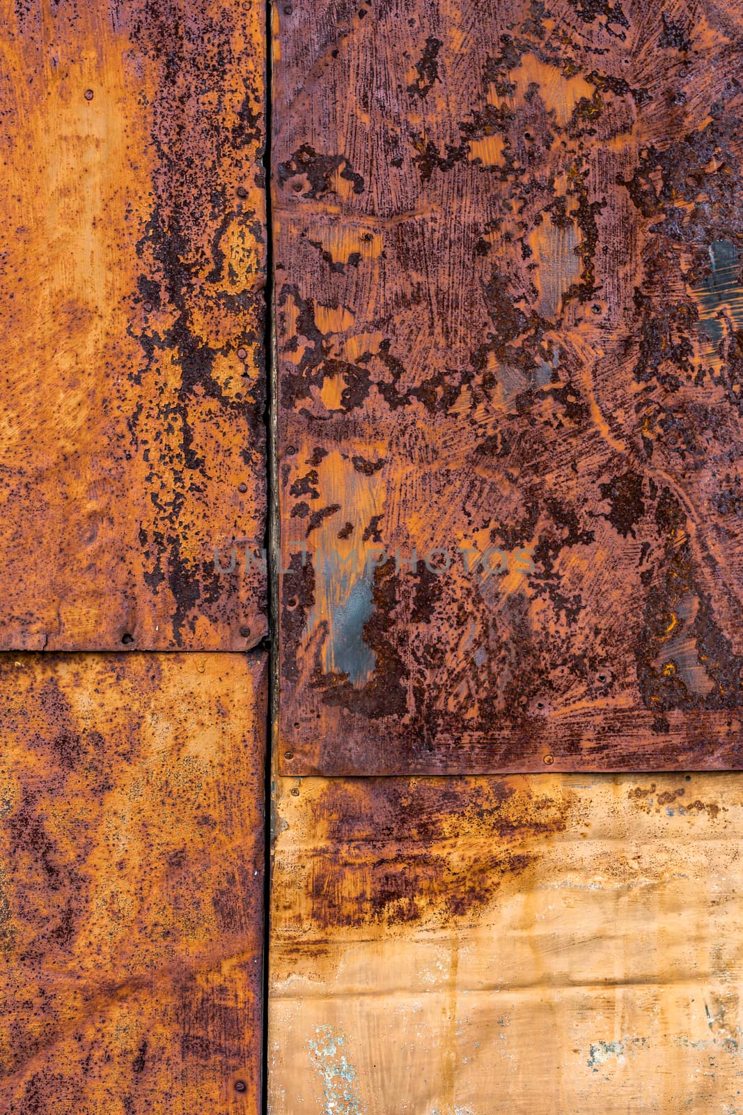 Several nailed rusted iron sheets flat background and texture